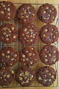 Mocha cookies with hazelnuts on a cooling rack