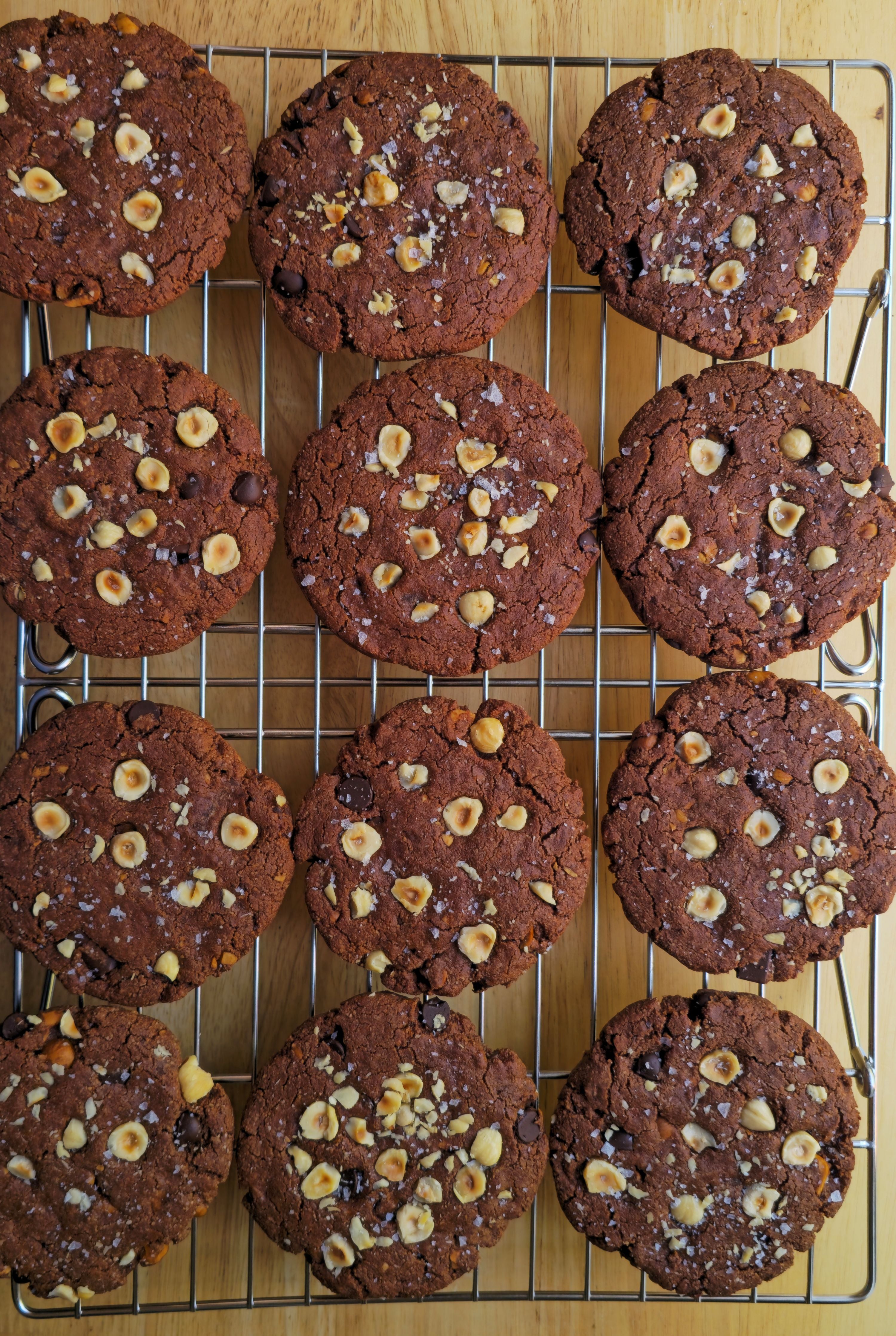 Mocha cookies with hazelnuts on a cooling rack